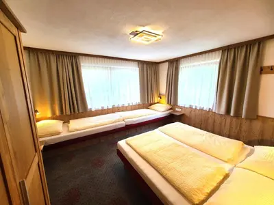 Ein Bett oder Betten in einem Zimmer der Unterkunft Ferienhaus Sonnhof am Walchsee