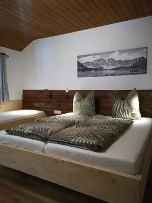 Ein Bett oder Betten in einem Zimmer der Unterkunft Altböckhof