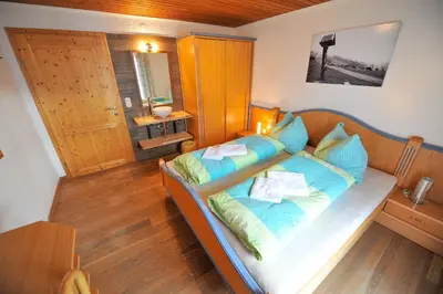 Ein Bett oder Betten in einem Zimmer der Unterkunft Pension Grubhof