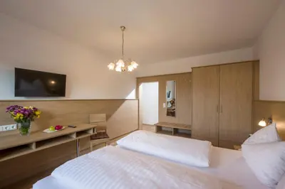 Ein Bett oder Betten in einem Zimmer der Unterkunft Hotel Restaurant Gradlwirt