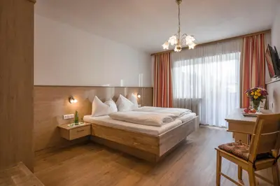 Ein Bett oder Betten in einem Zimmer der Unterkunft Hotel Restaurant Gradlwirt