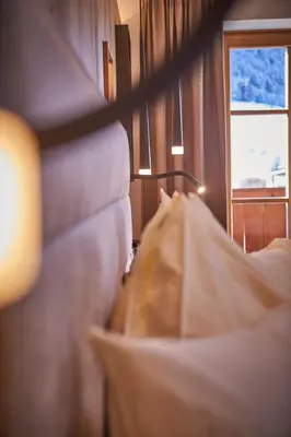 Ein Bett oder Betten in einem Zimmer der Unterkunft Bauernhof Hotel Oberschwarzach