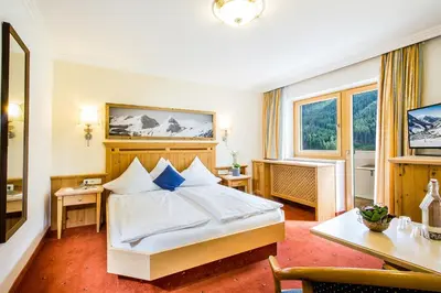 Ein Bett oder Betten in einem Zimmer der Unterkunft Hotel Das Kohlmais - direkt an der Kohlmaisbahn