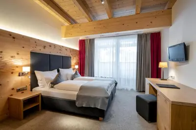 Ein Bett oder Betten in einem Zimmer der Unterkunft Ski & Bike Hotel Wiesenegg