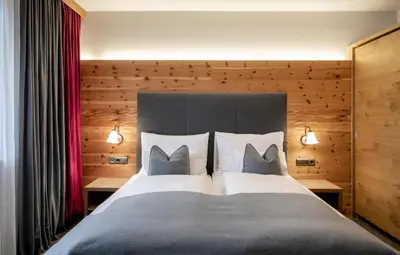 Ein Bett oder Betten in einem Zimmer der Unterkunft Ski & Bike Hotel Wiesenegg