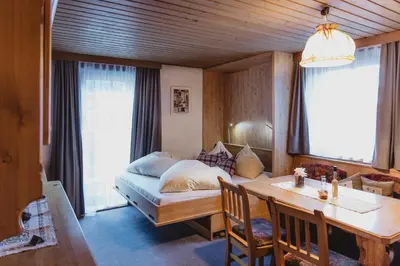 Ein Bett oder Betten in einem Zimmer der Unterkunft Pension Seighof