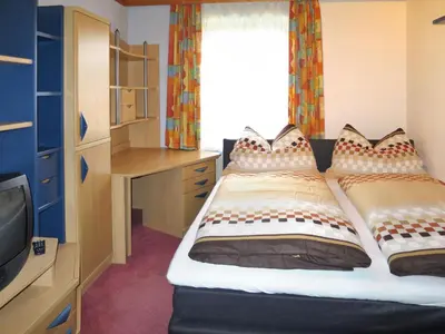 Ein Bett oder Betten in einem Zimmer der Unterkunft Apartment Stainer by Interhome