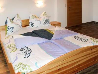 Ein Bett oder Betten in einem Zimmer der Unterkunft Apartment Edelweiss by Interhome