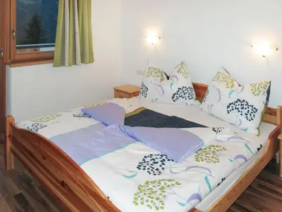 Ein Bett oder Betten in einem Zimmer der Unterkunft Apartment Edelweiss by Interhome