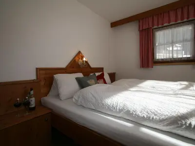 Ein Bett oder Betten in einem Zimmer der Unterkunft Chalet Heisenhaushütte by Interhome