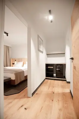 Ein Bett oder Betten in einem Zimmer der Unterkunft Hotel & Appartements Tiroler Buam