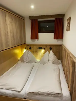 Ein Bett oder Betten in einem Zimmer der Unterkunft Appartements Kröll, Joker Card in summer included!