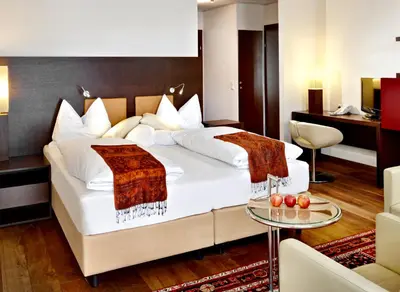Ein Bett oder Betten in einem Zimmer der Unterkunft Alpen-Karawanserai