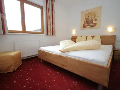 Ein Bett oder Betten in einem Zimmer der Unterkunft Apartment in Uderns near Ski Lift Hochzillertal