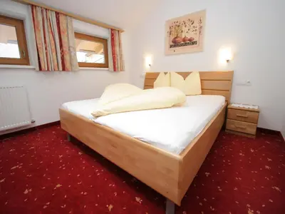 Ein Bett oder Betten in einem Zimmer der Unterkunft Spacious Apartment in Uderns near Ski Area