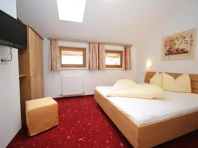 Ein Bett oder Betten in einem Zimmer der Unterkunft Spacious Apartment in Uderns near Ski Area