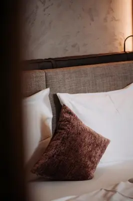 Ein Bett oder Betten in einem Zimmer der Unterkunft Hotel Salzburg