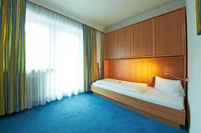 Ein Bett oder Betten in einem Zimmer der Unterkunft HELI'S Bed & Breakfast