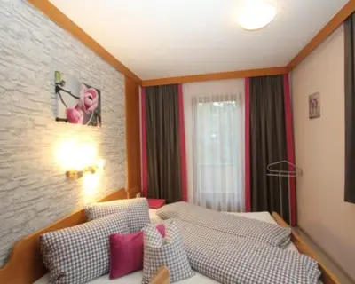 Ein Bett oder Betten in einem Zimmer der Unterkunft Stangleggerhof