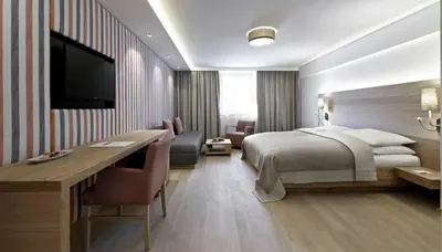 Ein Bett oder Betten in einem Zimmer der Unterkunft Schwarzer Adler Kitzbühel - Adults Only