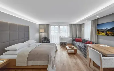 Ein Bett oder Betten in einem Zimmer der Unterkunft Schwarzer Adler Kitzbühel - Adults Only