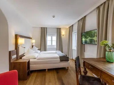 Ein Bett oder Betten in einem Zimmer der Unterkunft Hotel Gasthof Blaue Quelle