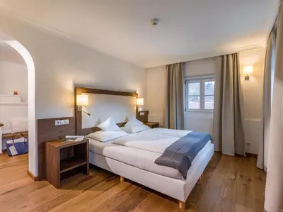 Ein Bett oder Betten in einem Zimmer der Unterkunft Hotel Gasthof Blaue Quelle