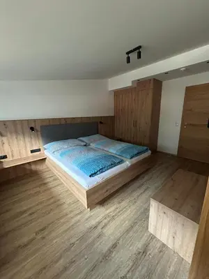 Ein Bett oder Betten in einem Zimmer der Unterkunft Gästehaus Wildauer