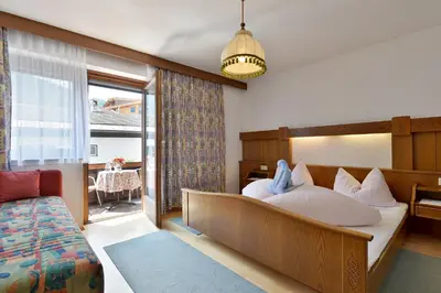 Ein Bett oder Betten in einem Zimmer der Unterkunft Apartments Ellmau im Sternhof