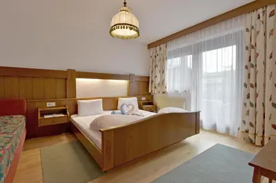 Ein Bett oder Betten in einem Zimmer der Unterkunft Apartments Ellmau im Sternhof