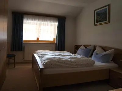 Ein Bett oder Betten in einem Zimmer der Unterkunft Bichlerhof