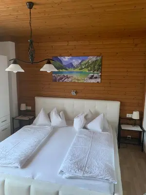 Ein Bett oder Betten in einem Zimmer der Unterkunft Landhof Aigner