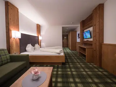 Ein Bett oder Betten in einem Zimmer der Unterkunft Hotel Alphof Alpbach