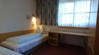 Ein Bett oder Betten in einem Zimmer der Unterkunft Appartementhotel Hechenberg