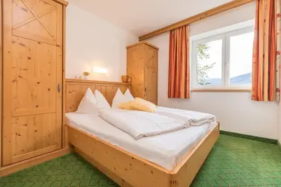 Ein Bett oder Betten in einem Zimmer der Unterkunft Alpenhof Apartments