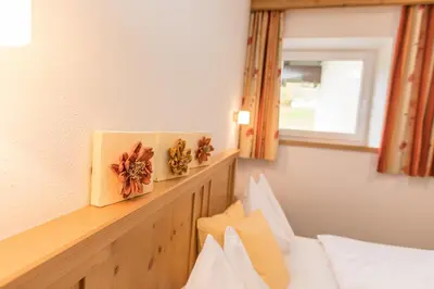 Ein Bett oder Betten in einem Zimmer der Unterkunft Alpenhof Apartments