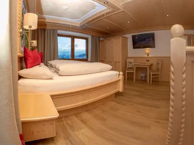 Ein Bett oder Betten in einem Zimmer der Unterkunft Gasthof Tannen - Alm