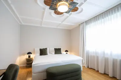 Ein Bett oder Betten in einem Zimmer der Unterkunft Q! Hotel Maria Theresia