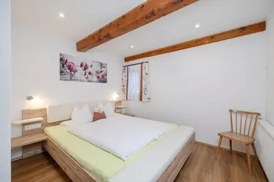 Ein Bett oder Betten in einem Zimmer der Unterkunft Tatscherhof