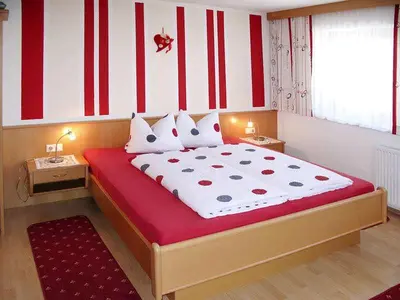 Ein Bett oder Betten in einem Zimmer der Unterkunft Tatscherhof