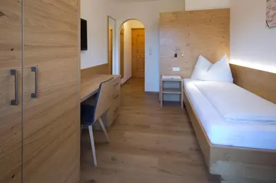Ein Bett oder Betten in einem Zimmer der Unterkunft Gästehaus Brantlhof Zimmer und Ferienwohnungen in Going am Wilden Kaiser