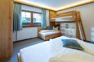 Ein Bett oder Betten in einem Zimmer der Unterkunft Gästehaus Brantlhof Zimmer und Ferienwohnungen in Going am Wilden Kaiser