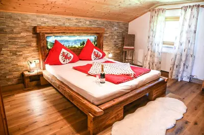 Ein Bett oder Betten in einem Zimmer der Unterkunft Ferienhaus Schneiderhäusl Zillertal