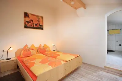 Ein Bett oder Betten in einem Zimmer der Unterkunft Lanzenbauernhof