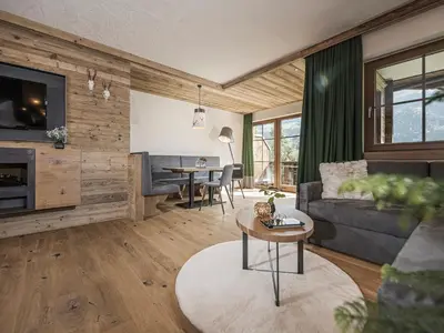 Ein Sitzbereich in der Unterkunft Aparthotel Stacherhof