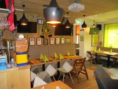 Ein Restaurant oder anderes Speiselokal in der Unterkunft Aparthotel Garni Schranz