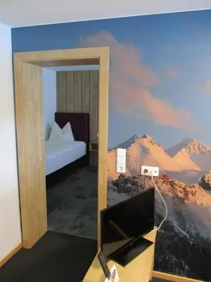 Ein Bett oder Betten in einem Zimmer der Unterkunft Aparthotel Garni Schranz