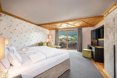 Ein Bett oder Betten in einem Zimmer der Unterkunft Der Böglerhof - pure nature spa resort