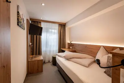 Ein Bett oder Betten in einem Zimmer der Unterkunft Gasthof Aschenwald