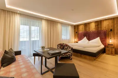 Ein Bett oder Betten in einem Zimmer der Unterkunft Hotel Garni Jagdhof
